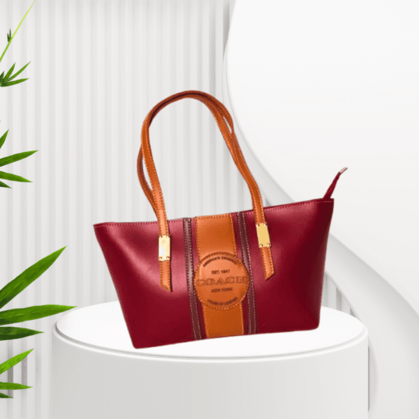 "Maroon and tan leather tote bag with gold-tone hardware – Stylish ladies' handbag for everyday use